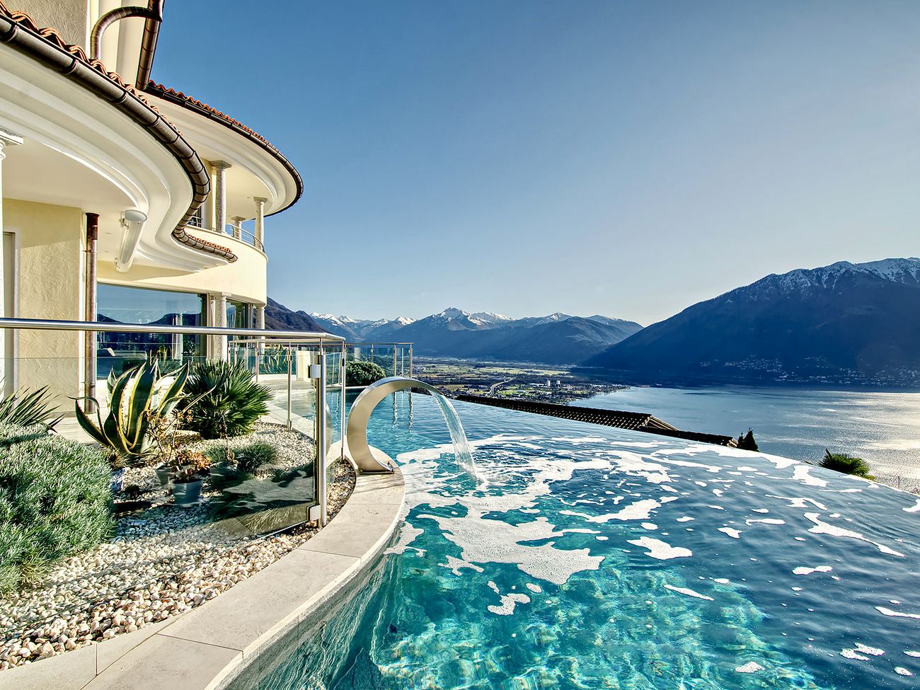 Infinity pool overlooking a Swiss lake