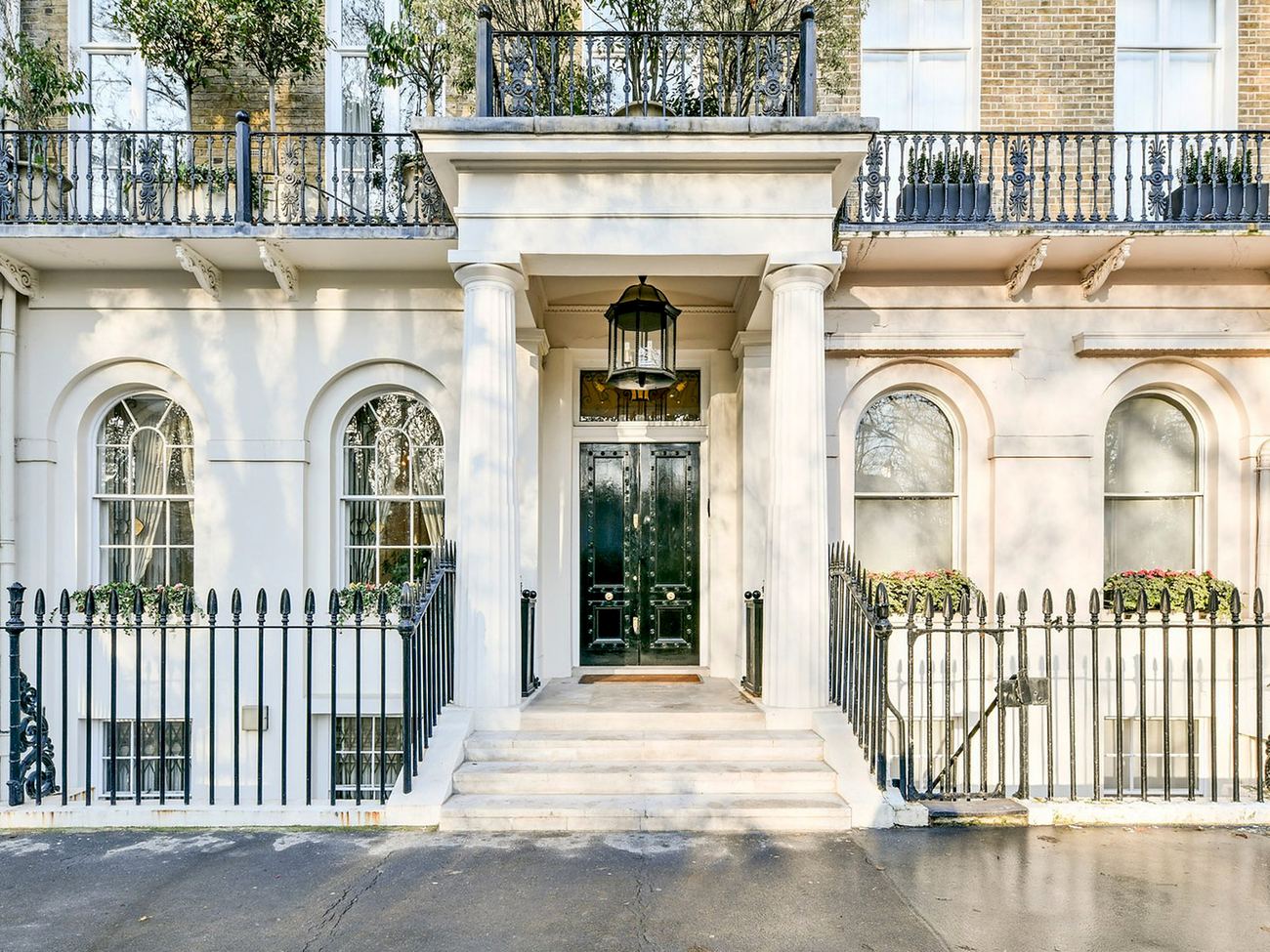 Classical white stucco townhouse entrance in London