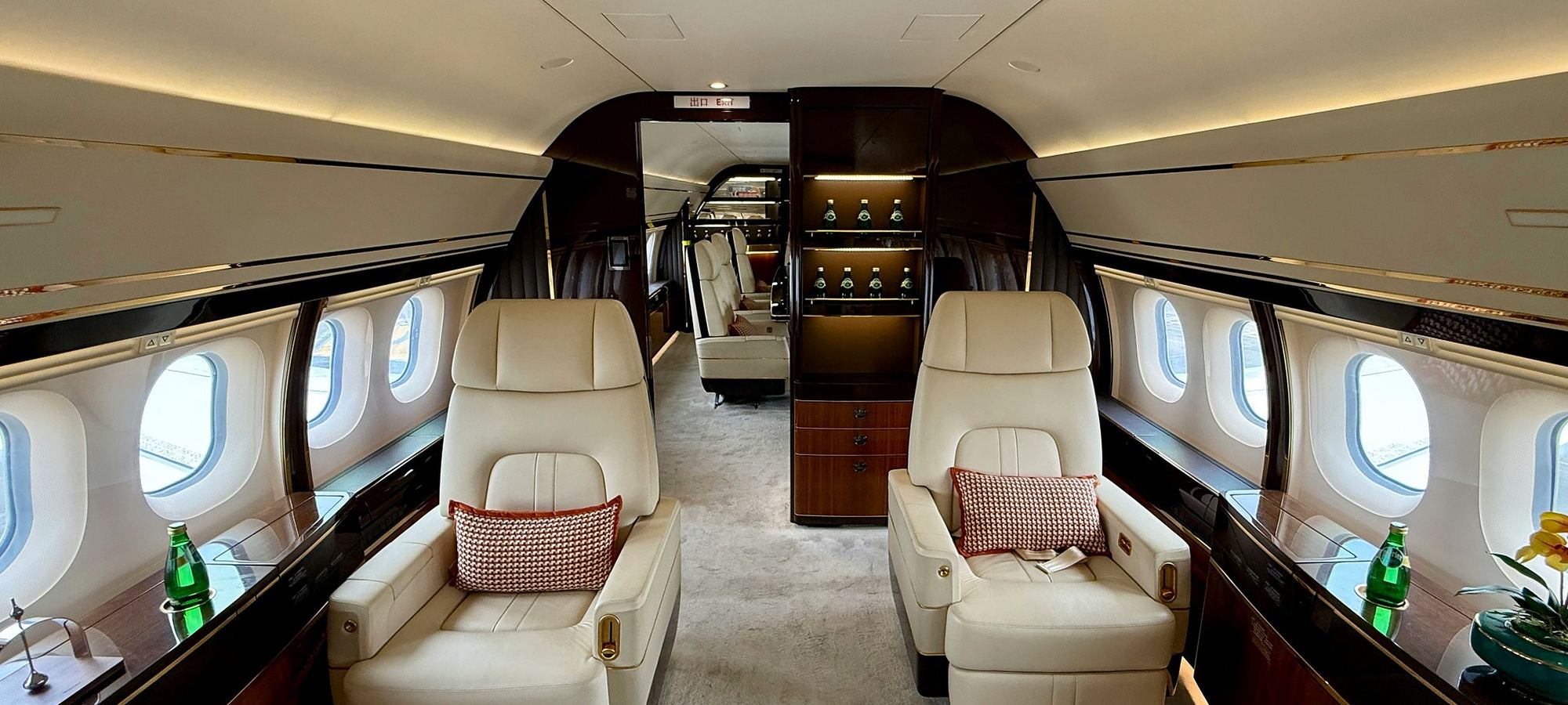 Private jet cabin with cream leather seating