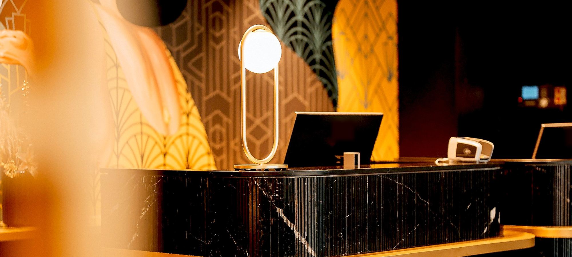 Black marble and gold reception desk