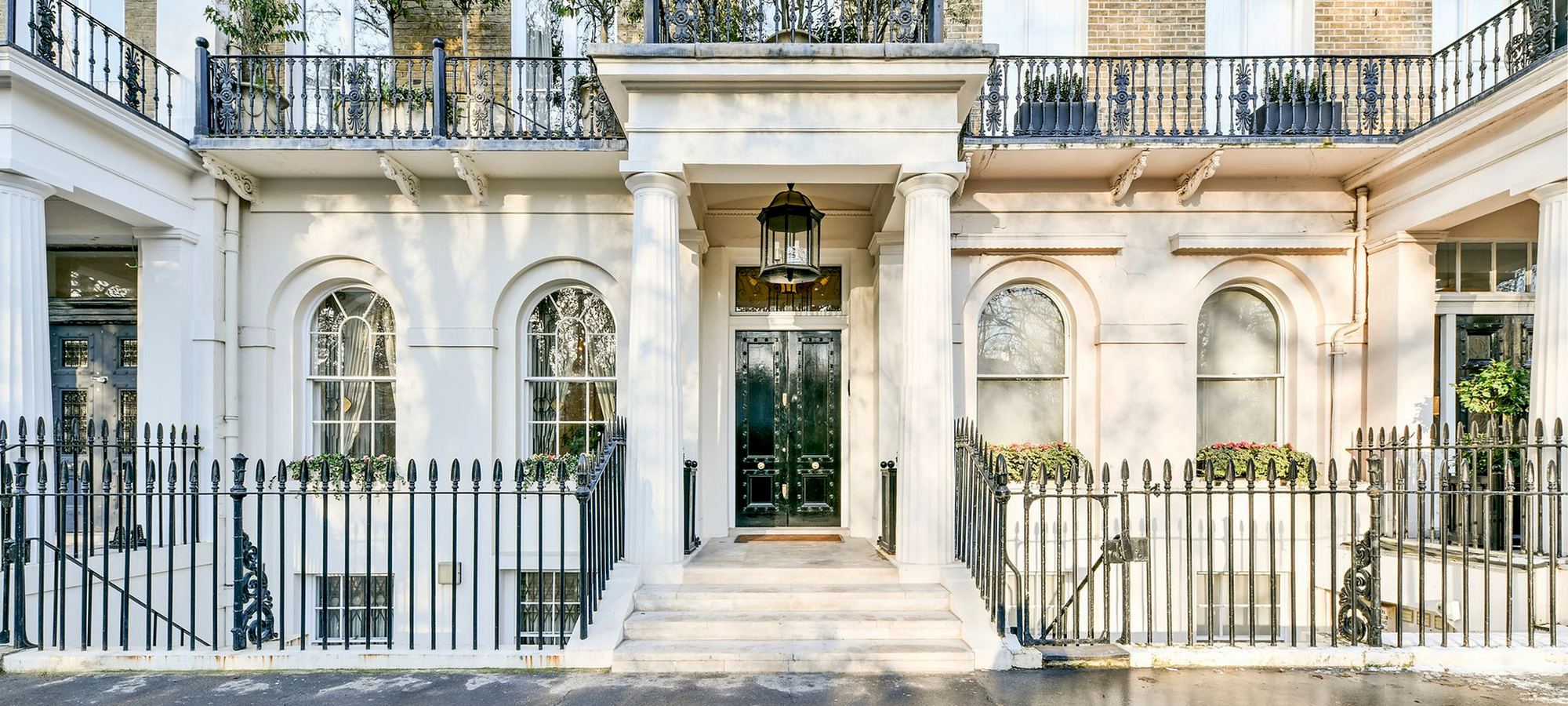 Classical white stucco townhouse entrance in London